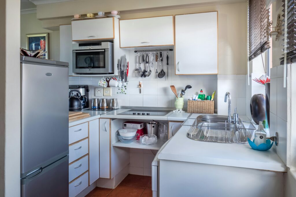 pexels-photo-1599791-1599791 Sophisticated kitchen interior with modern appliances, wooden accents, and functional design.